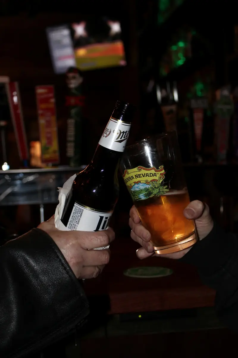 A beer raised over the bar
