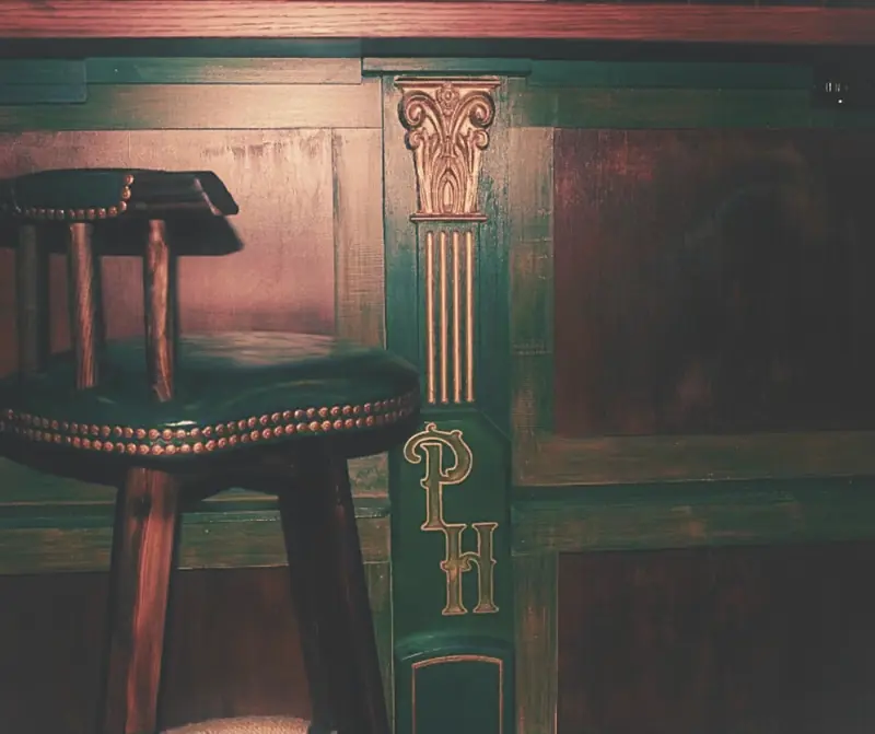The green bar front with its gold PH monogram
