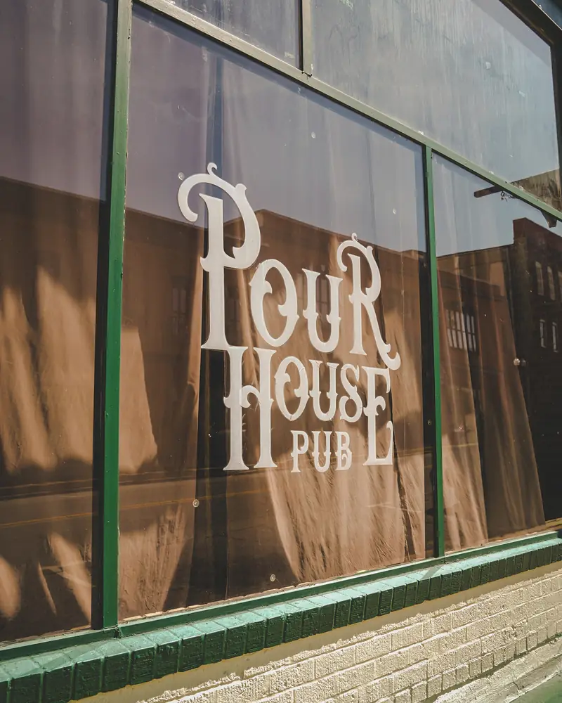 The Pour House Pub lettering on the front window